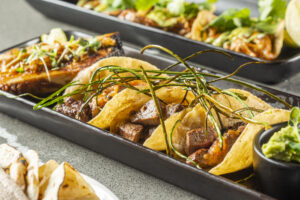 Monarco's tacos de filete are from the Josper grill, which brings a "kiss" of charcoal flavor.
