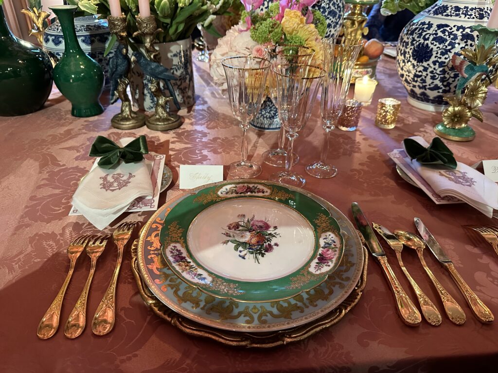 Lucas Somoza set the birthday dinner table with 19th century Sevres porcelain on loan from a private collector. (Photo by Shelby Hodge)