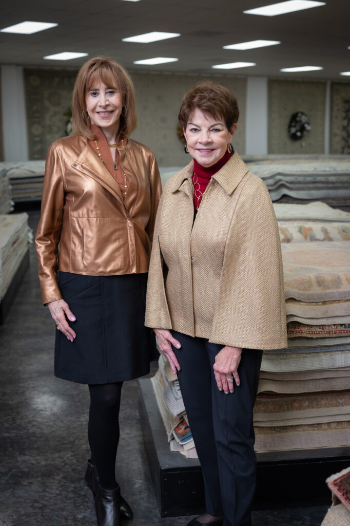 Vicki West, Debbie Leighton at the Turkish Rug Company showroom grand opening party benefiting the Salvation Army.