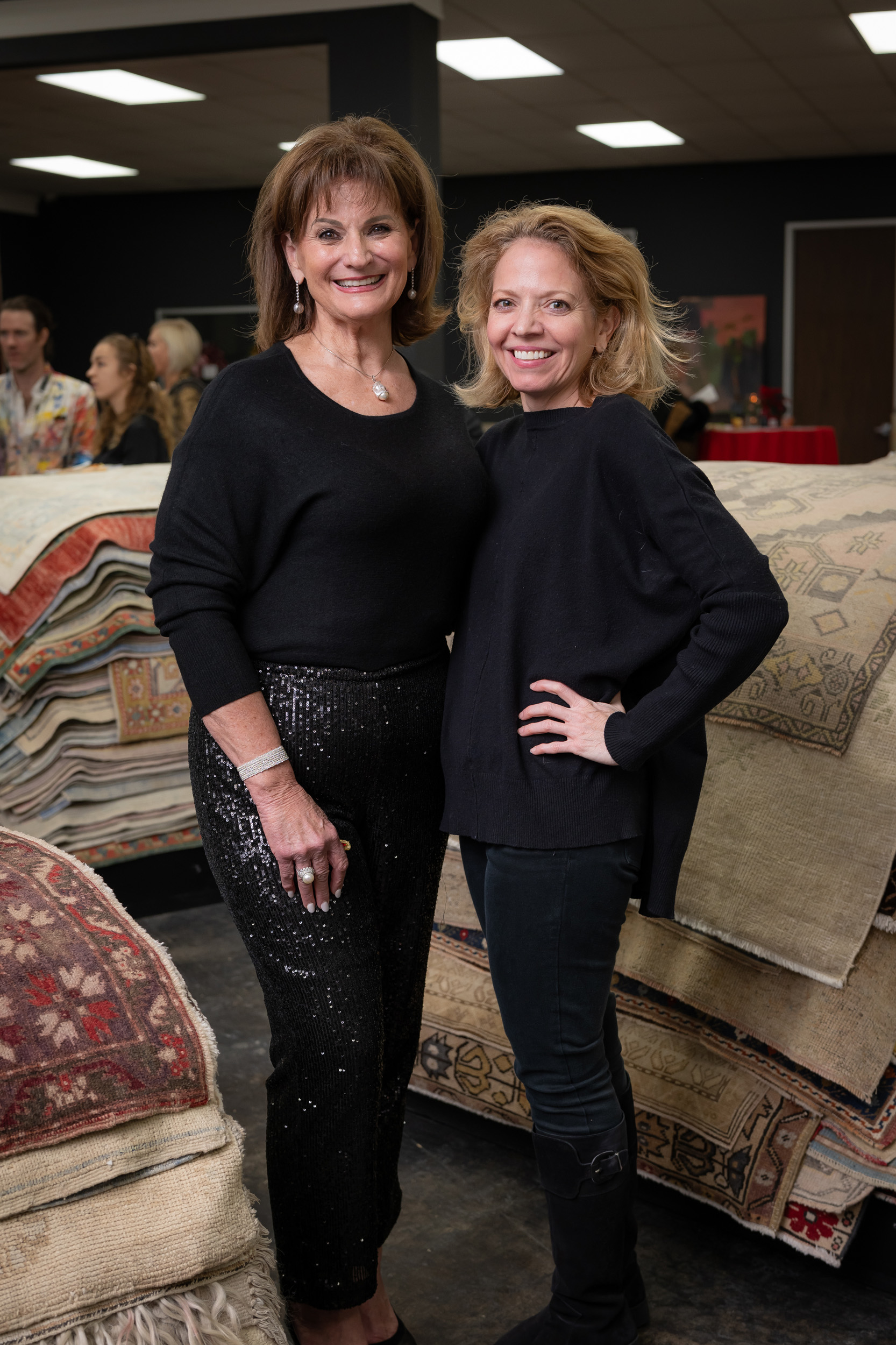 Wreath design winner Beth Dow, Julie Sacco at the Turkish Rug Company showroom grand opening party benefiting the Salvation Army.