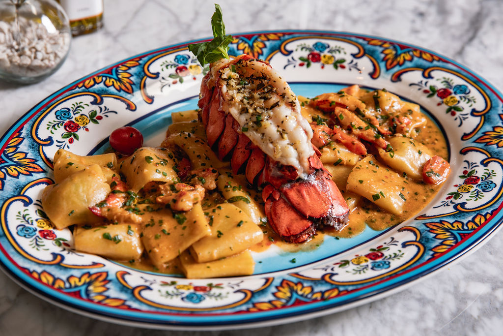 The entree Paccheri All'aragosta at  Lombardi Cucina Italiana is composed with Maine lobster, cherry tomato sauce, parsley and extra virgin olive oil. ($42)