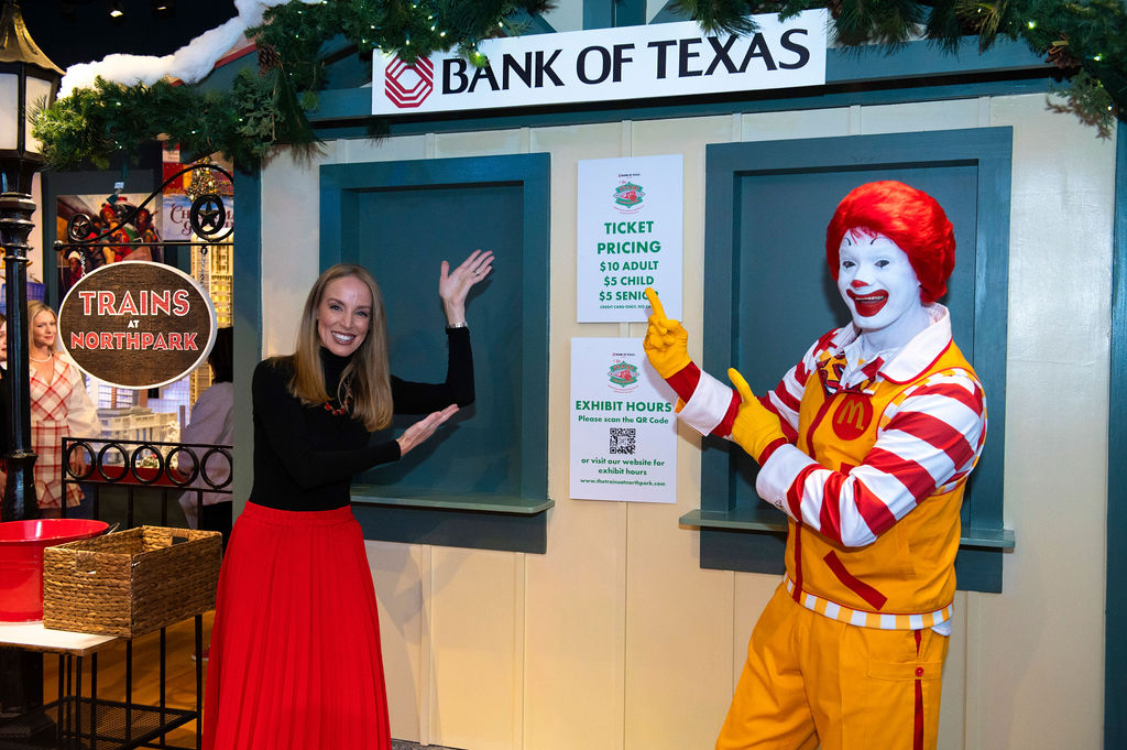Mandy Austin (Bank of Texas) and Ronald McDonald at the sneak peek of the 2023 Trains at NorthPark.