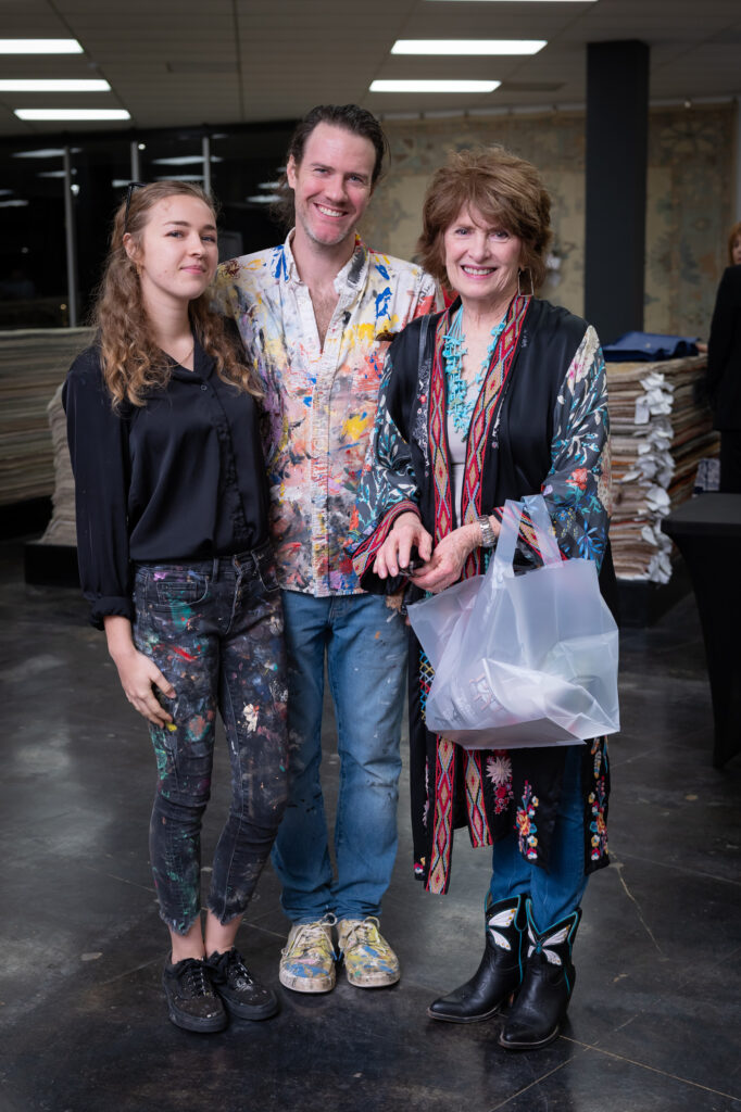Nichole Petrie, Chris Bachman, Jamie Sawicki at the Turkish Rug Company showroom grand opening party benefiting the Salvation Army.