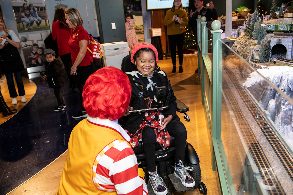 Ronald McDonald and the 2023 "kid conductor" Serenity Williams at the sneak peek of the Trains at NorthPark