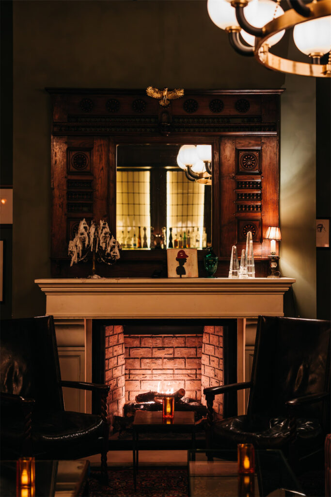 A grand fireplace inspired by Gramercy Park Hotel’s iconic Rose Bar is a highlight of The Rô on Oak space. (Courtesy)