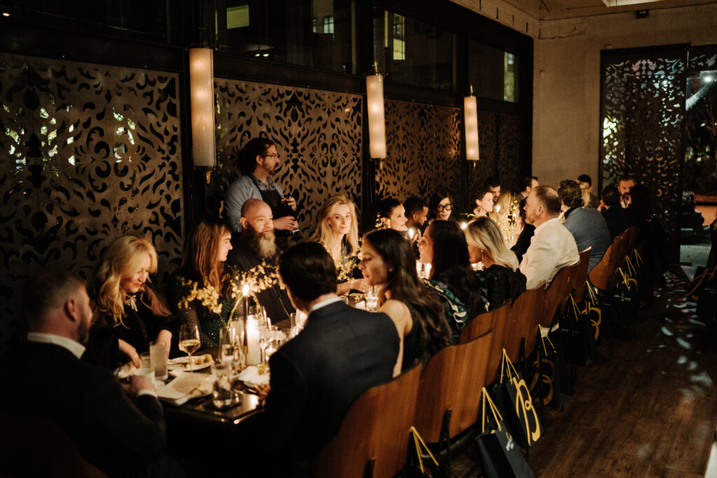 Guests enjoying the chic dinner at Grange Hall (Photo by Afritina Coker)