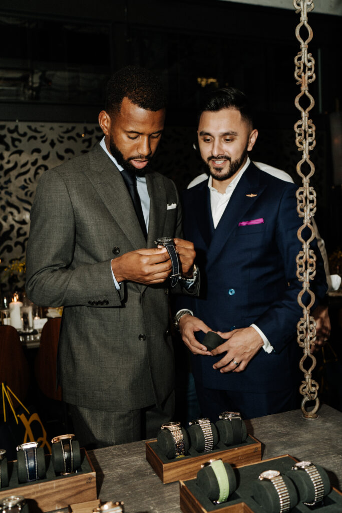 Kellyn Acosta and Eddie Bañales shop Breitling watches at Grange Hall. (Photo by Afritina Coker)