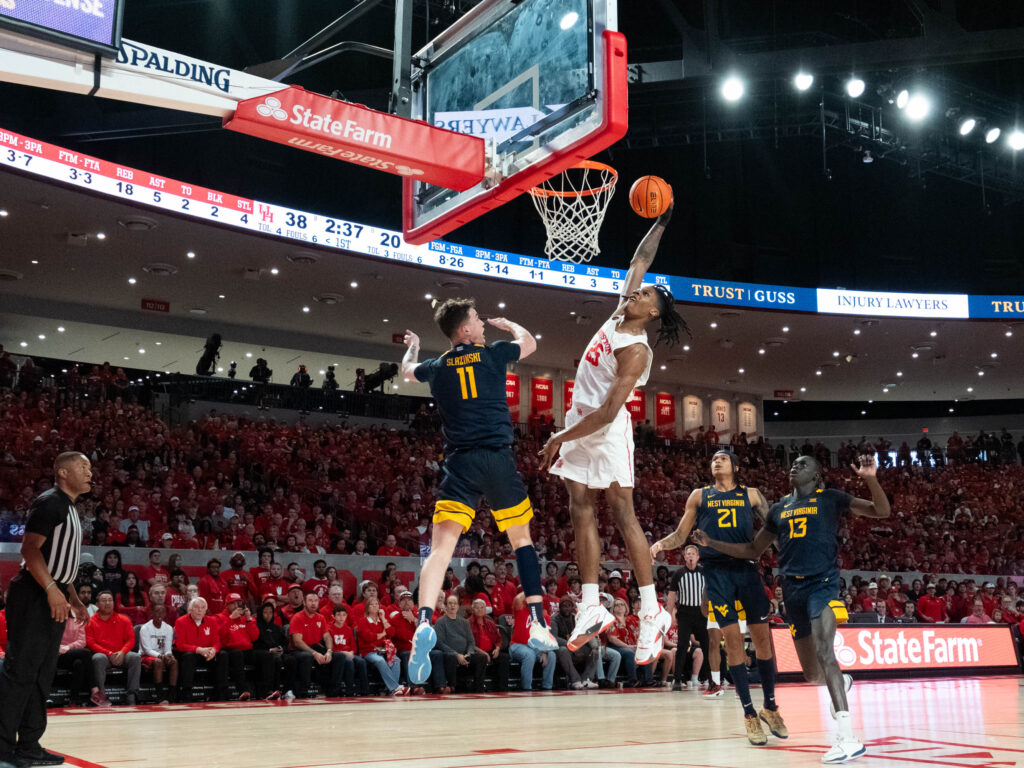 University of Houston freshman big man JoJo Tugler's one-handed slam dunk is a thing of beauty. (Photo by F. Carter Smith)