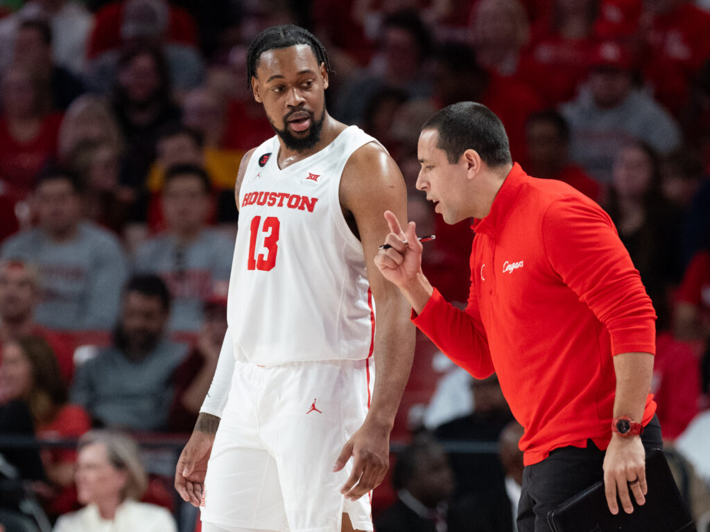 University of Houston forward J'Wan Roberts gets some very specific instructions from assistant coach Kellen Sampson. (Photo by F. Carter Smith)