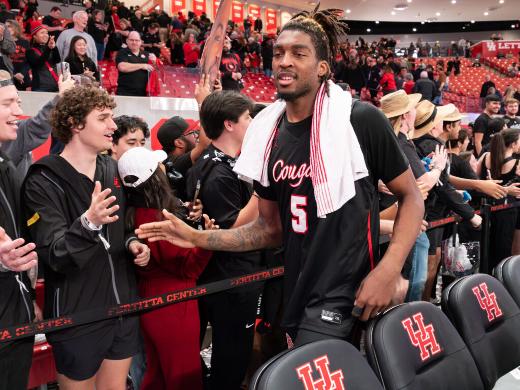 UH center Ja'Vier Francis is a man of the people, mingling with the student section. (Photo by F. Carter Smith)