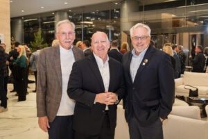Joel Deretchin, former Congressman Kevin Brady and Dan Kolkhorst make the scene at the 2024 Hometown Heroes reveal at The Waterway Towers.