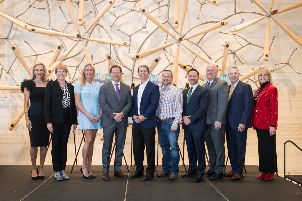 Missy Herndon, president and CEO of Interfaith of The Woodlands, Kay Boehn-Fannin, Nicole Murphy, Will Murphy, Justin Kendrick, Andy Davis, Dr. Stephen Popp, Dr. Mark Murrell, Ray Sanders, and Nelda Blair make the Hometown Heroes scene.