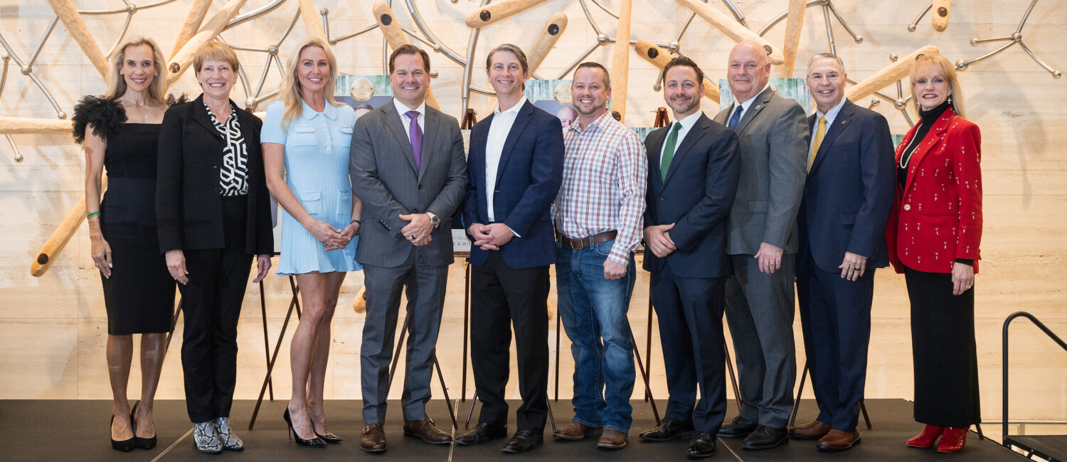 Missy Herndon, president and CEO of Interfaith of The Woodlands, Kay Boehn-Fannin, Nicole Murphy, Will Murphy, Justin Kendrick, Andy Davis, Dr. Stephen Popp, Dr. Mark Murrell, Ray Sanders, and Nelda Blair make the Hometown Heroes scene.