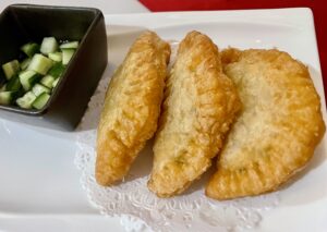 Megu – Delicate curry puffs off the French menu at Megu. (Photo by Courtney Dabney)