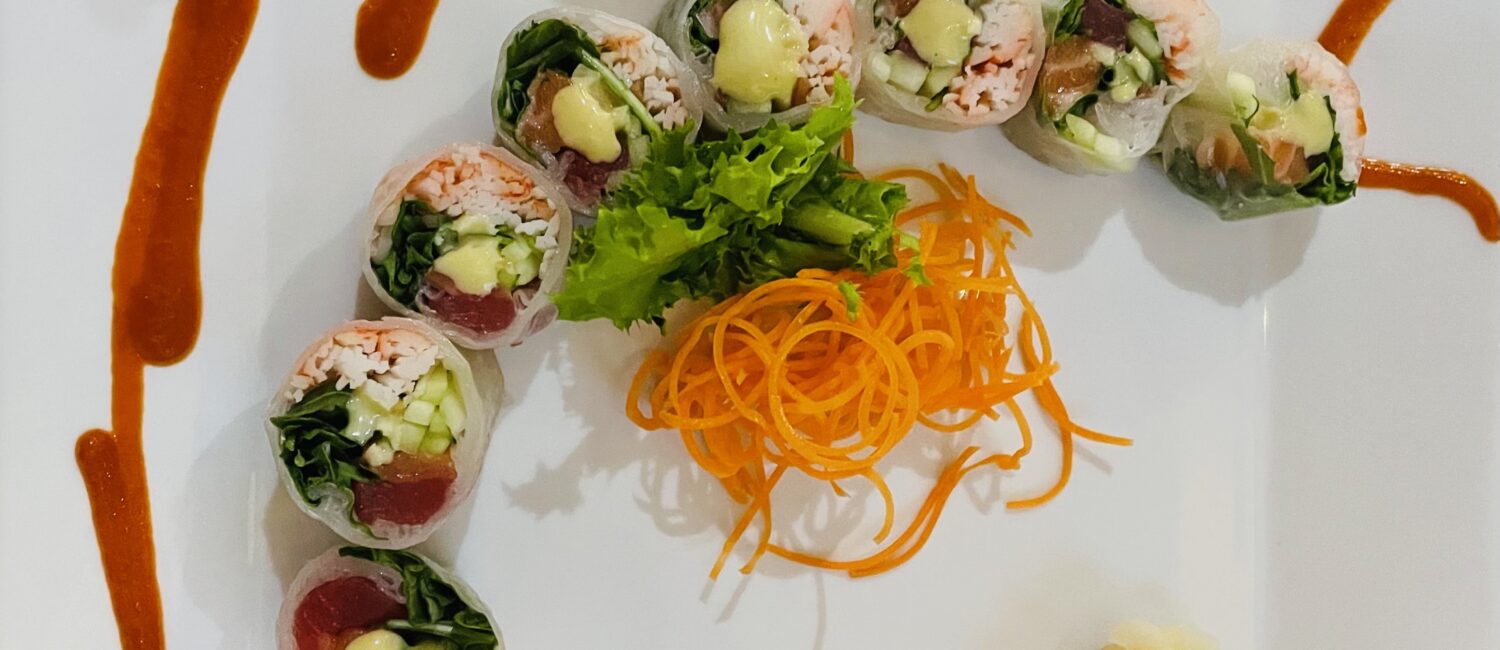 Megu – The soy paper wrapped spring in Paris roll plate painted with spicy Sriracha. (Photo by Courtney Dabney)