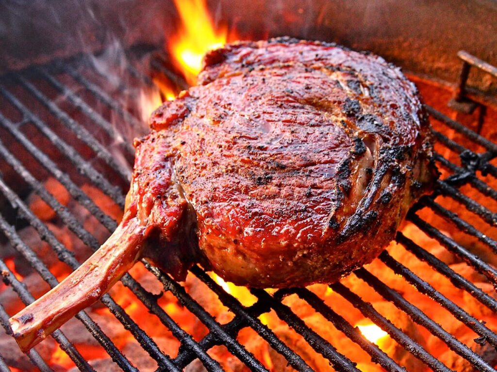 Behold the bone-in ribeye hot off the grill at Cattleman's Steak House.