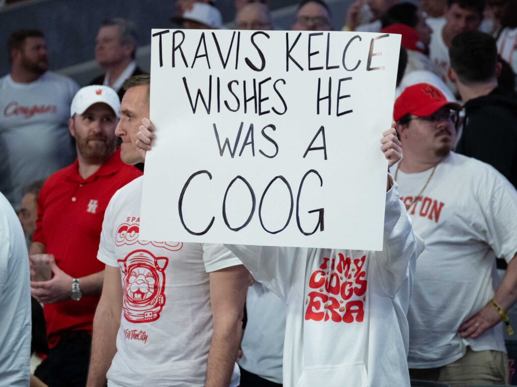 UH fans had a little fun with Cincinnati and its most famous product — the Taylor Swift dating Travis Kelce. UH power forward J'Wan Roberts gives some love to the Houston student section after another Fertitta Center. (Photo by F. Carter Smith)