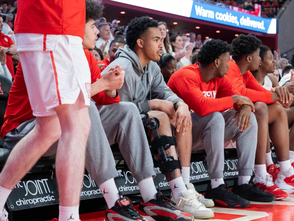 University of Houston has two key rotation pieces — Ramon Walker Jr. (gray hoodie) and Terrance Arceneaux (red sweatshirt) to season-ending injuries. (Photo by F. Carter Smith)