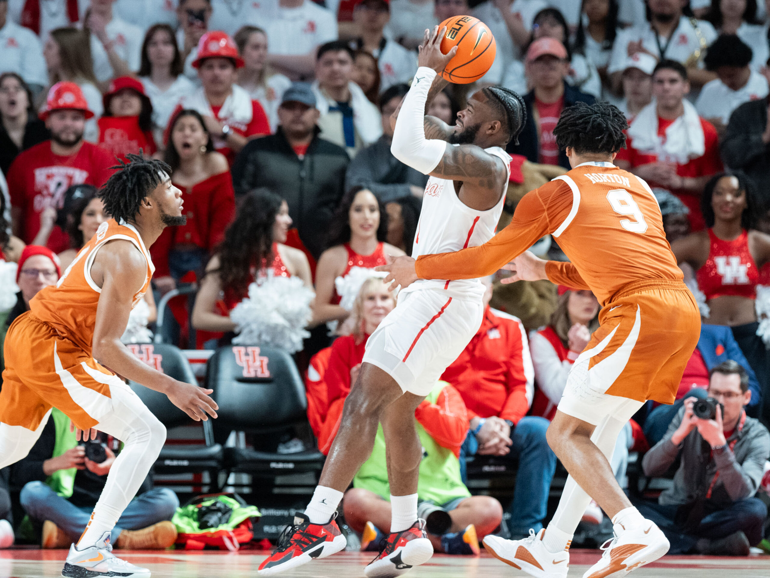 The #3 Houston Cougars defeated the Texas Longhorns in an 82-61 wire-to-wire win behind 26 points from guard L.J. Cryer . The Cougars used a big second half to hold Texas to a season-low scoring mark at the Fertitta Center
