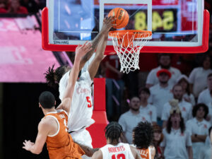 The #3 Houston Cougars defeated the Texas Longhorns in an 82-61 wire-to-wire win behind 26 points from guard L.J. Cryer . The Cougars used a big second half to hold Texas to a season-low scoring mark at the Fertitta Center