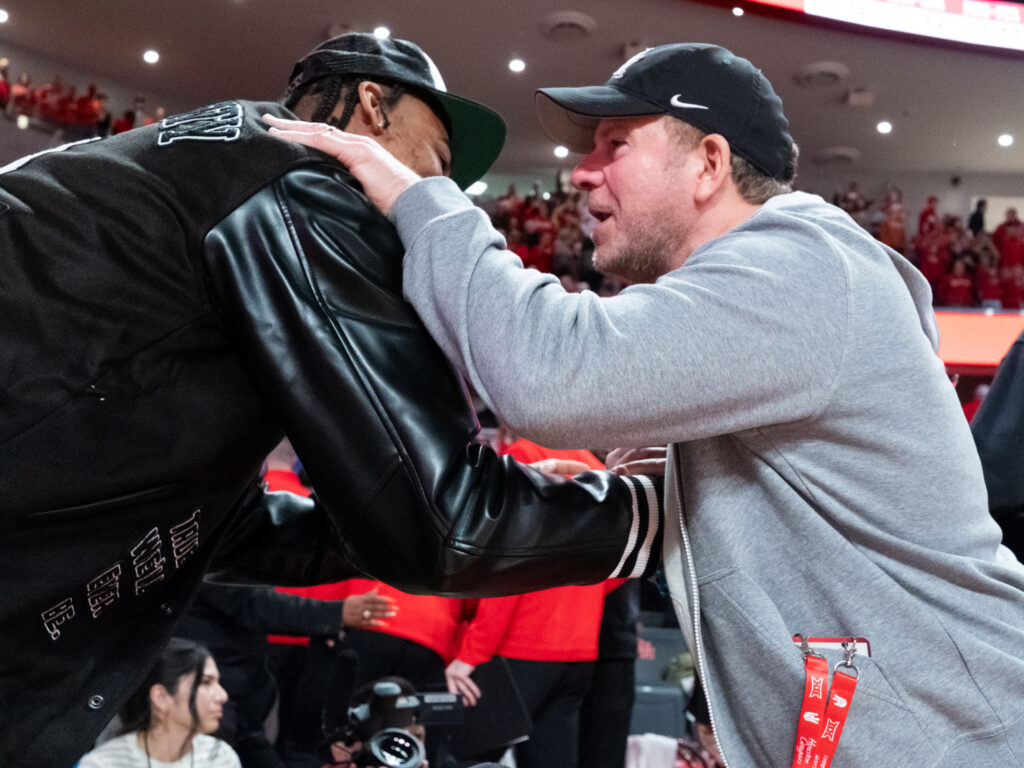 Nate Hinton received a warm welcome back to campus by UH billionaire backer Tilman Fertitta. (Photo by F. Carter Smith)