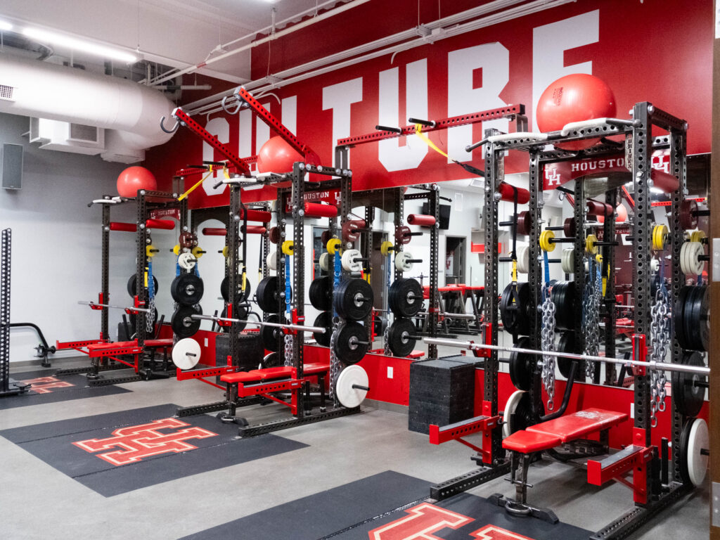 University of Houston basketball's revamped Guy V. Lewis facility includes a weight room where Alan Bishop gets his guys to put in the work. (Photo by F. Carter Smith)