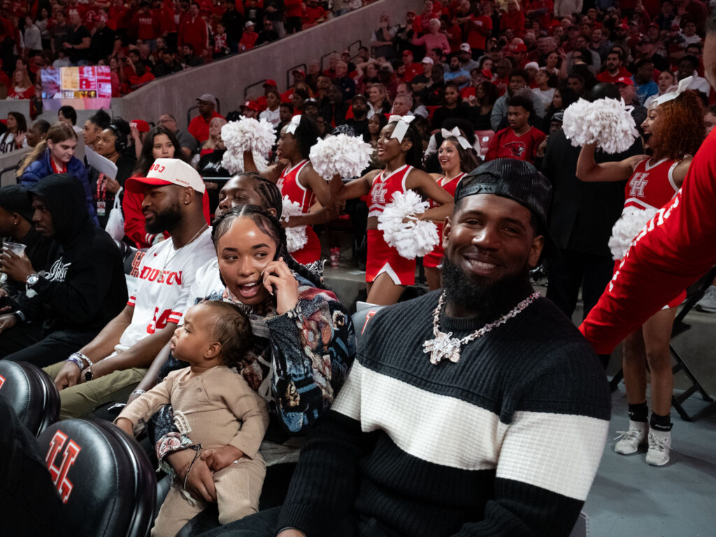 UH football stars Ed Oliver and Tyus Bowser came back to campus to see Kelvin Sampson's Houston basketball team. (Photo by F. Carter Smith)