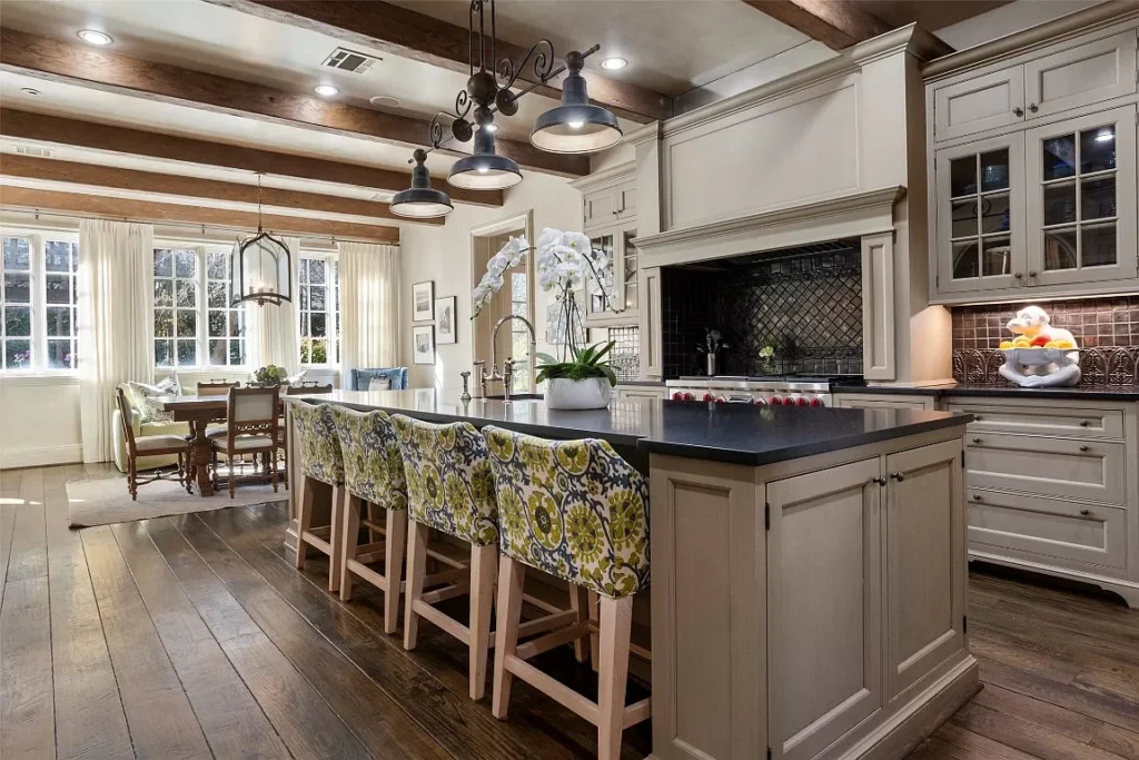 3640 Middlewood's kitchen features heavy beams overhead and wide planks underfoot — adding to the old-world feel. (Courtesy photo)