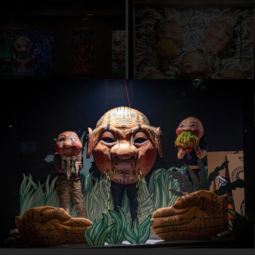 Artist Kill Joy's Ion Building installation "Creation, Current, Solution," 2023. The installation includes animatronic puppets made of painted cardboard. (Photo by Marc Furi Creative)