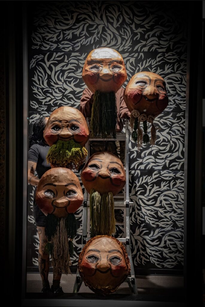 Artist Kill Joy's Ion Building installation "Creation, Current, Solution," 2023. The installation includes animatronic puppets made of painted cardboard. (Photo by Marc Furi Creative)