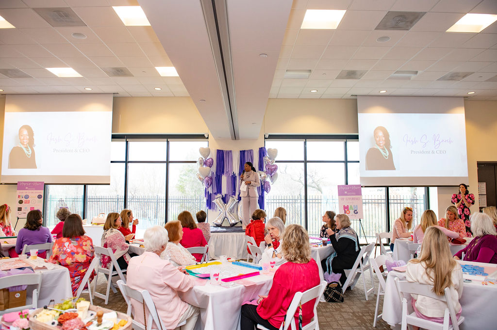 Irish S. Burch addressing guests at Mahjong for a Mission. (Photo by Tamytha Cameron)