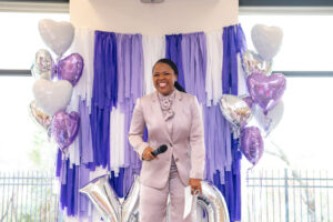 Irish S. Burch welcoming guests (Photo by Tamytha Cameron)