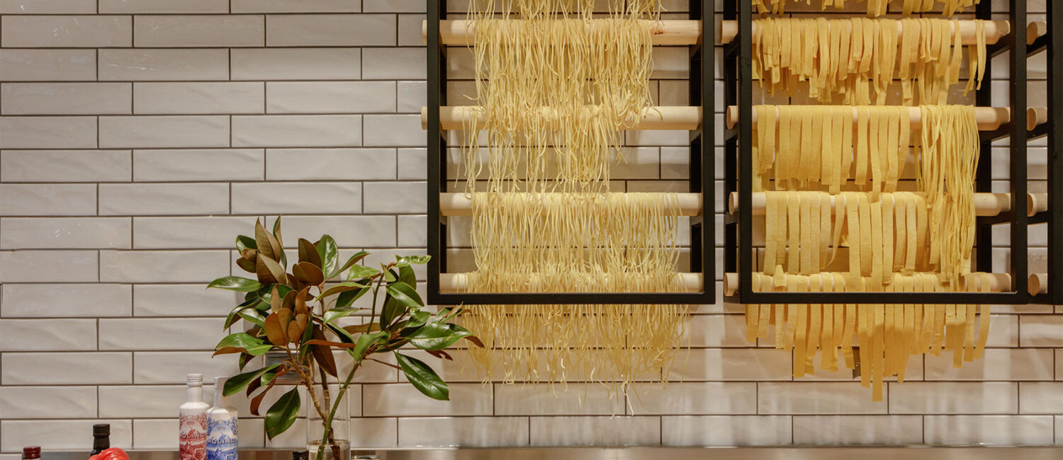 Italian – the pasta station inside il Modo displays the freshly made pasta drying on wooden racks.