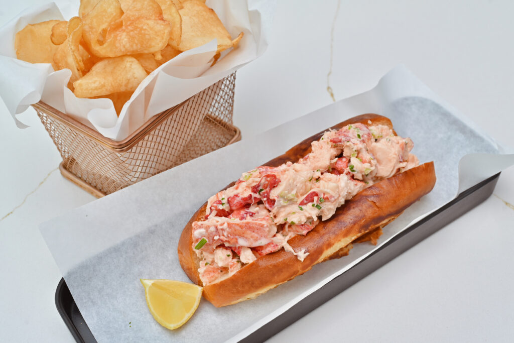 MF Lobster & Ceviche's lobster roll and house-made chips.
