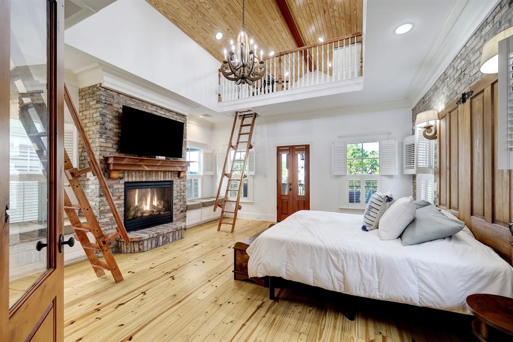 The master bedroom is home to pine floorings and interesting architectural details. 