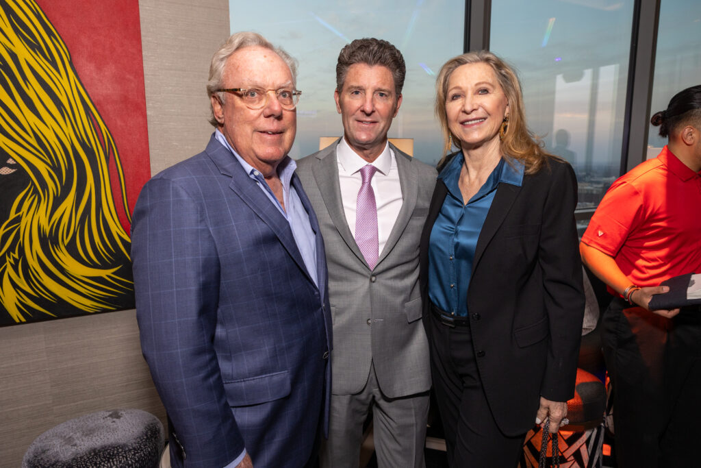 Mike Linn, Brian White, Carol Linn at the Texas Children's Houston Open Tee-Off in the penthouse suite at the Post Oak Hotel.  (Photo by Jenny Antill)
