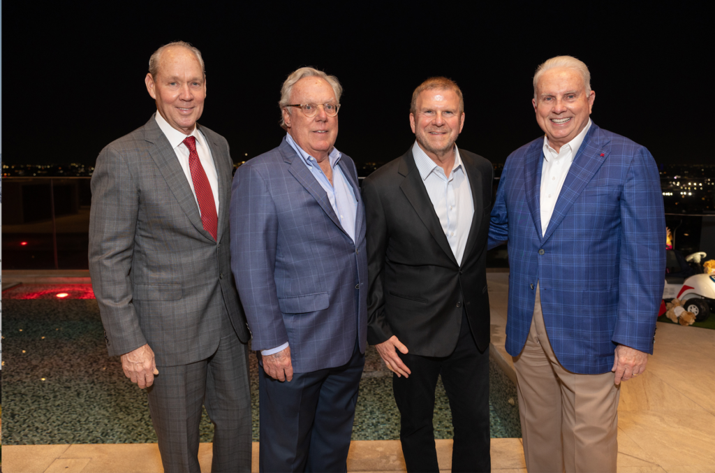Jim Crane, Mike Linn, Tilman Fertitta, Mark A. Wallace — the big guns at the Texas Children's Houston Open Tee-Off party held in the two-story penthouse suite at Fertitta's Post Oak Hotel. (Photo by Jenny Antill)