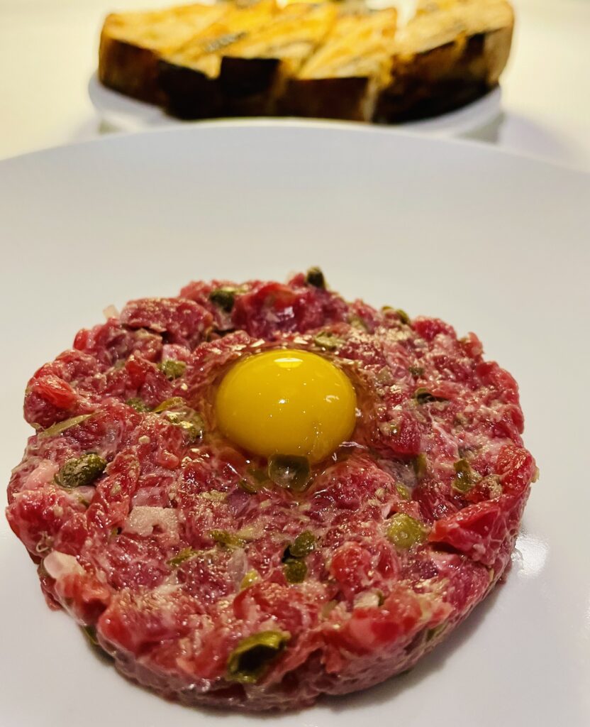 Wagyu beef tartare with shallots, Dijonaise and capers topped with a quail egg. (Photo by Courtney Dabney)