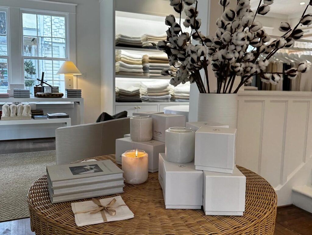 Candles and books set a cozy scene in the Peacock Alley Dallas store. 