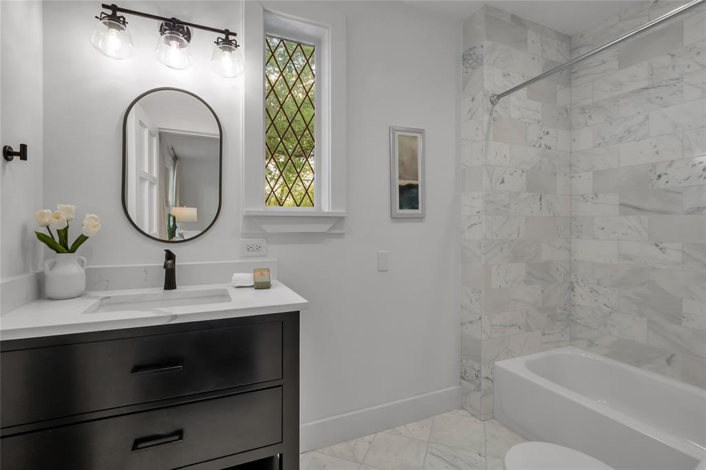 Modern bathrooms retain hints of the home's long history.