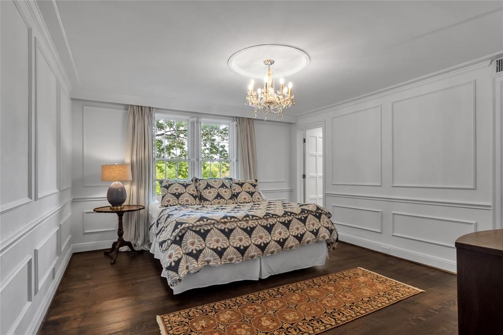 One of six bedrooms with custom millwork details of a bygone era.