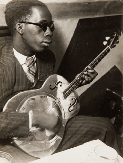 Brassaï's photo of Guadeloupian guitarist, pianist and banjo player Claude Martial at Club Cabane Cubaine, 1931, Paris, France. (Photo by Brassaï)