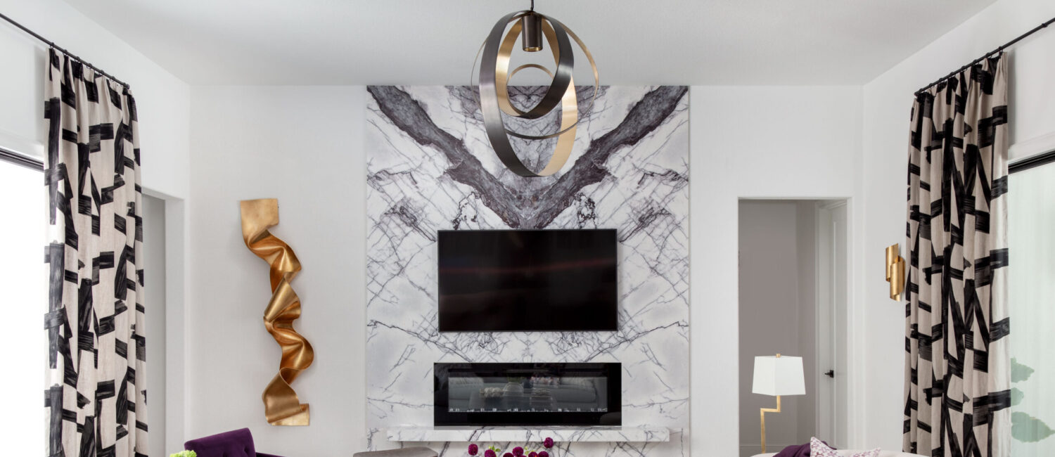 A vibrant pop of purple keeps the living room colorful in the Toll Brother's home in Woodson's Reserve.
