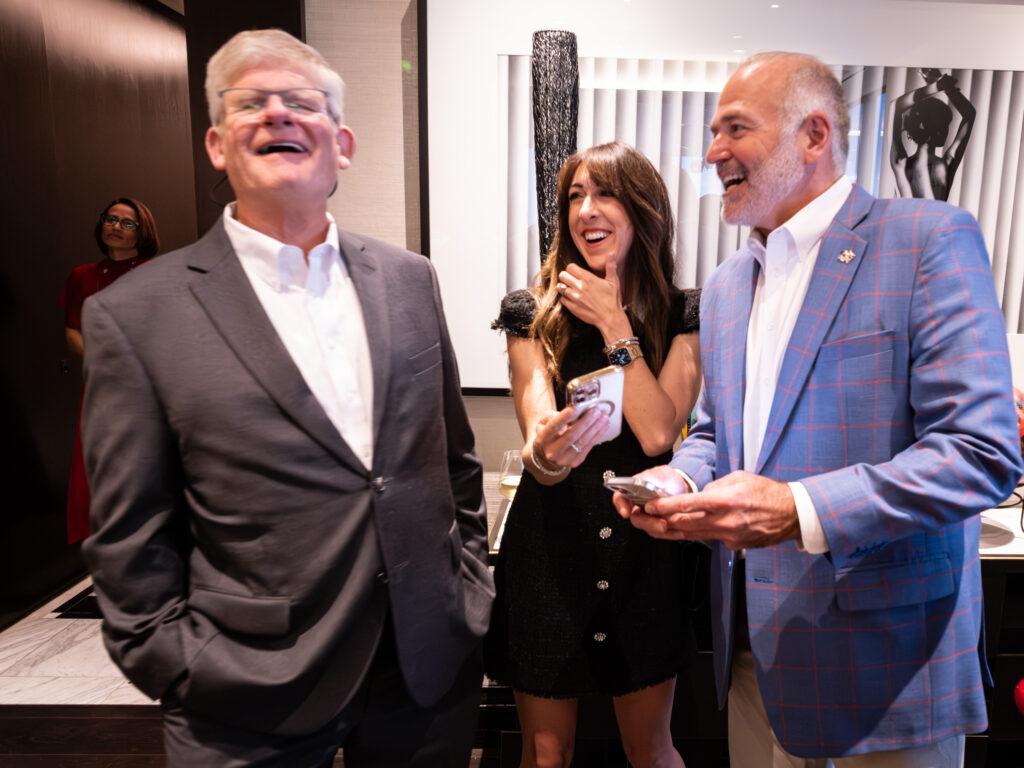 Kimberly Keenum and University of Houston athletic director Chris Pezman (right) enjoyed the Selection Sunday party. (Photo by F. Carter Smith)