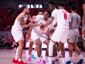 University of Houston head coach Kelvin Sampson visited with Drew Richards, head coach of the UNC Pembroke Braves, his alma mater, before an exhibition contest