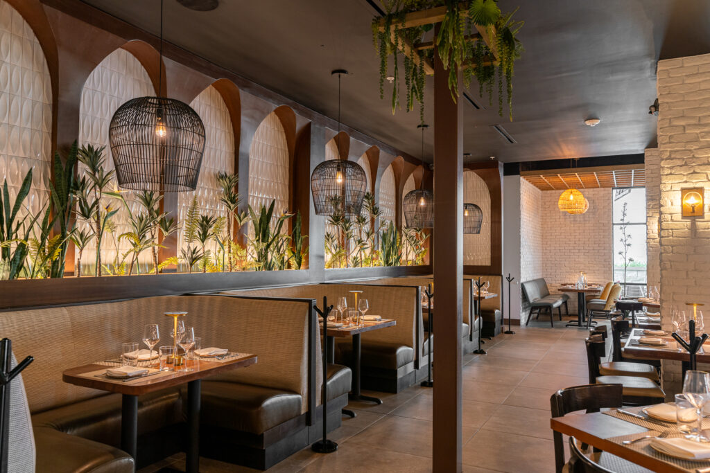 Very Handsome Studio achieved a Latin vibe at Costa Fina with lots of plants. Each seating area has lighting that defines the space. (Photo by Fajar Hassan)