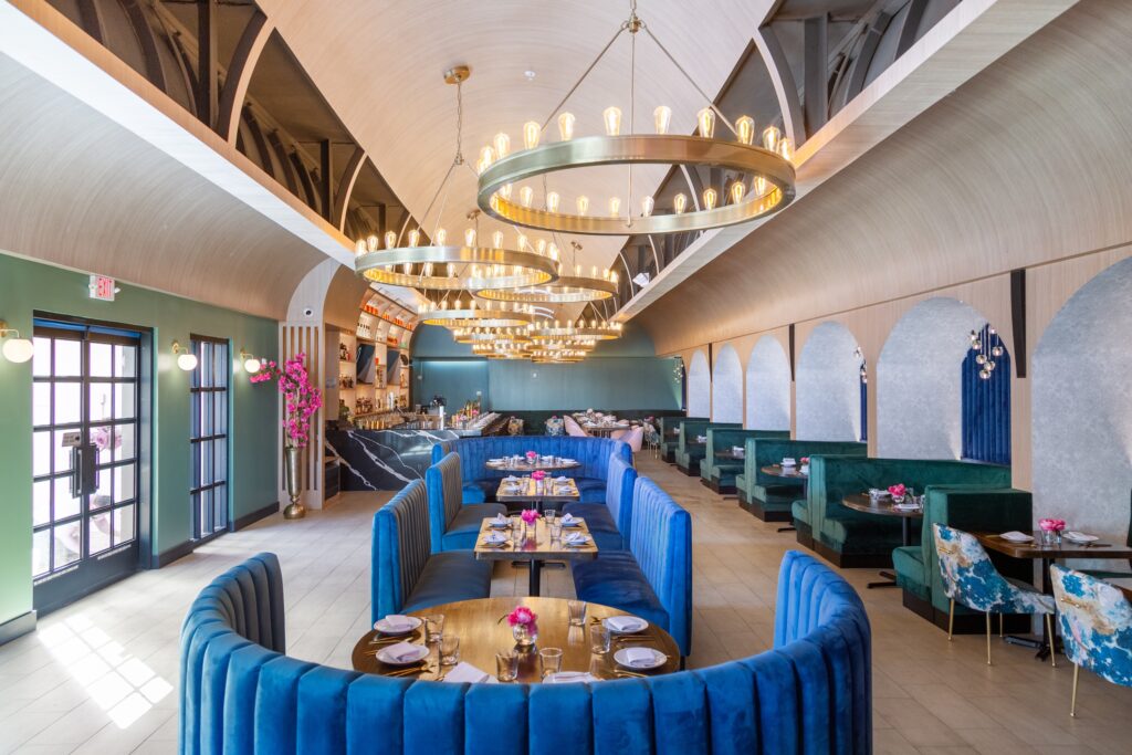 The comfortable interiors at the new all-day eatery, Duchess feature banquettes upholstered in jewel tones.  (Photo by Jenn Duncan)