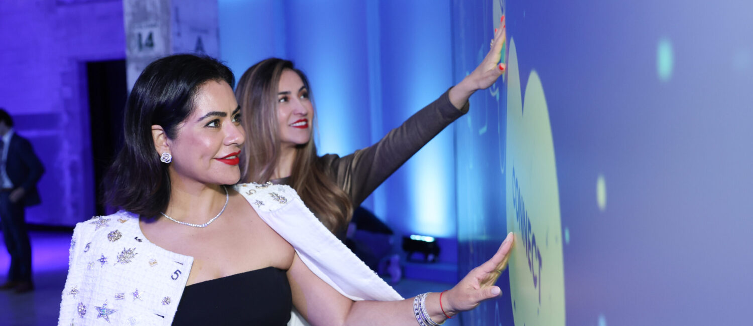 Elia Gabbanelli & Guest Interacting with Heart Strings Exhibit (Photo by Priscilla Dickson)