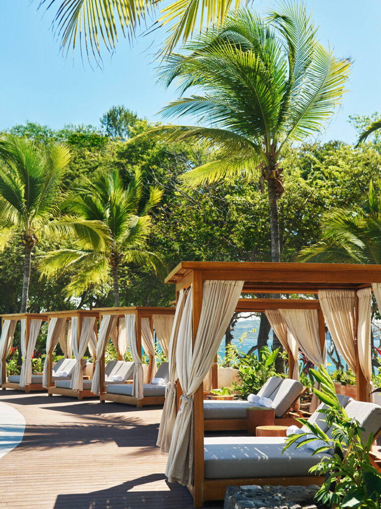 Cabanas are available to relax poolside.