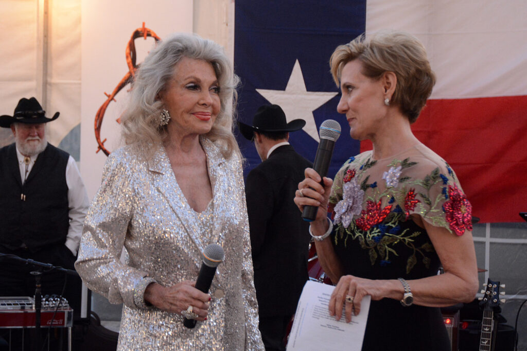 Longtime Young Texas Artists (YTA) volunteer Lyn Howard (left) was honored for years of volunteer service during YTA’s Bach, Beethoven & Barbecue gala March 9.  With her is  YTA President/CEO Susie Pokorski. (Photo by David Hopper)